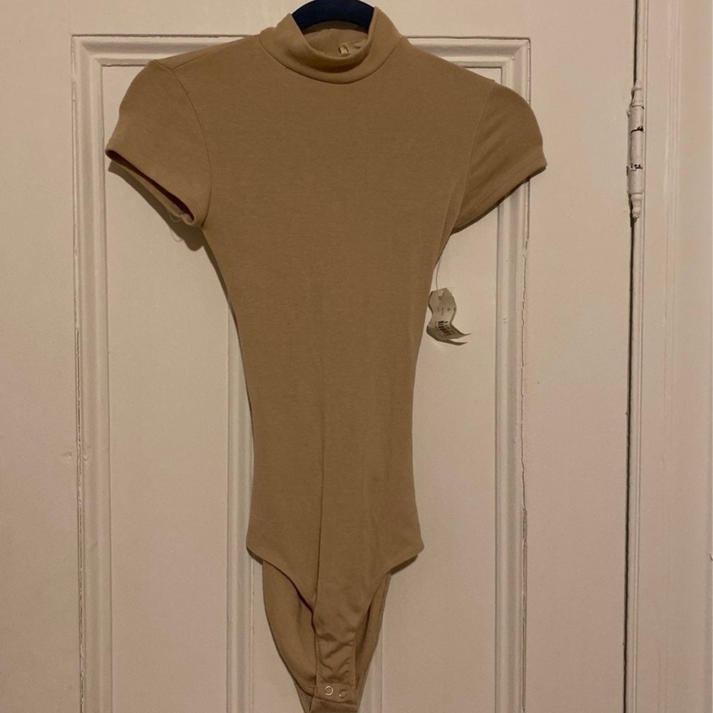 Beige bodysuit with open back